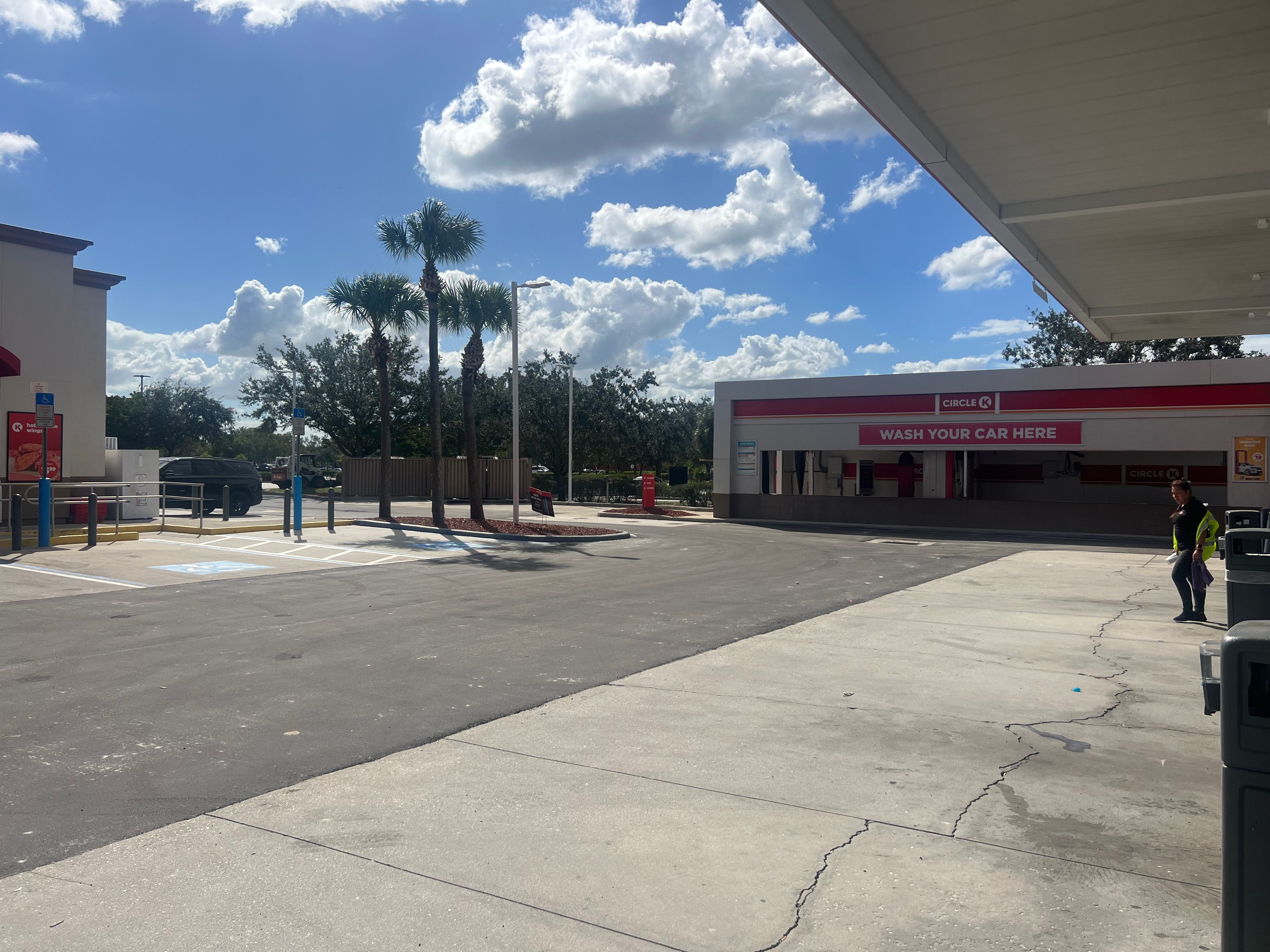 Asphalt pavement work beside a Circle K store and car wash