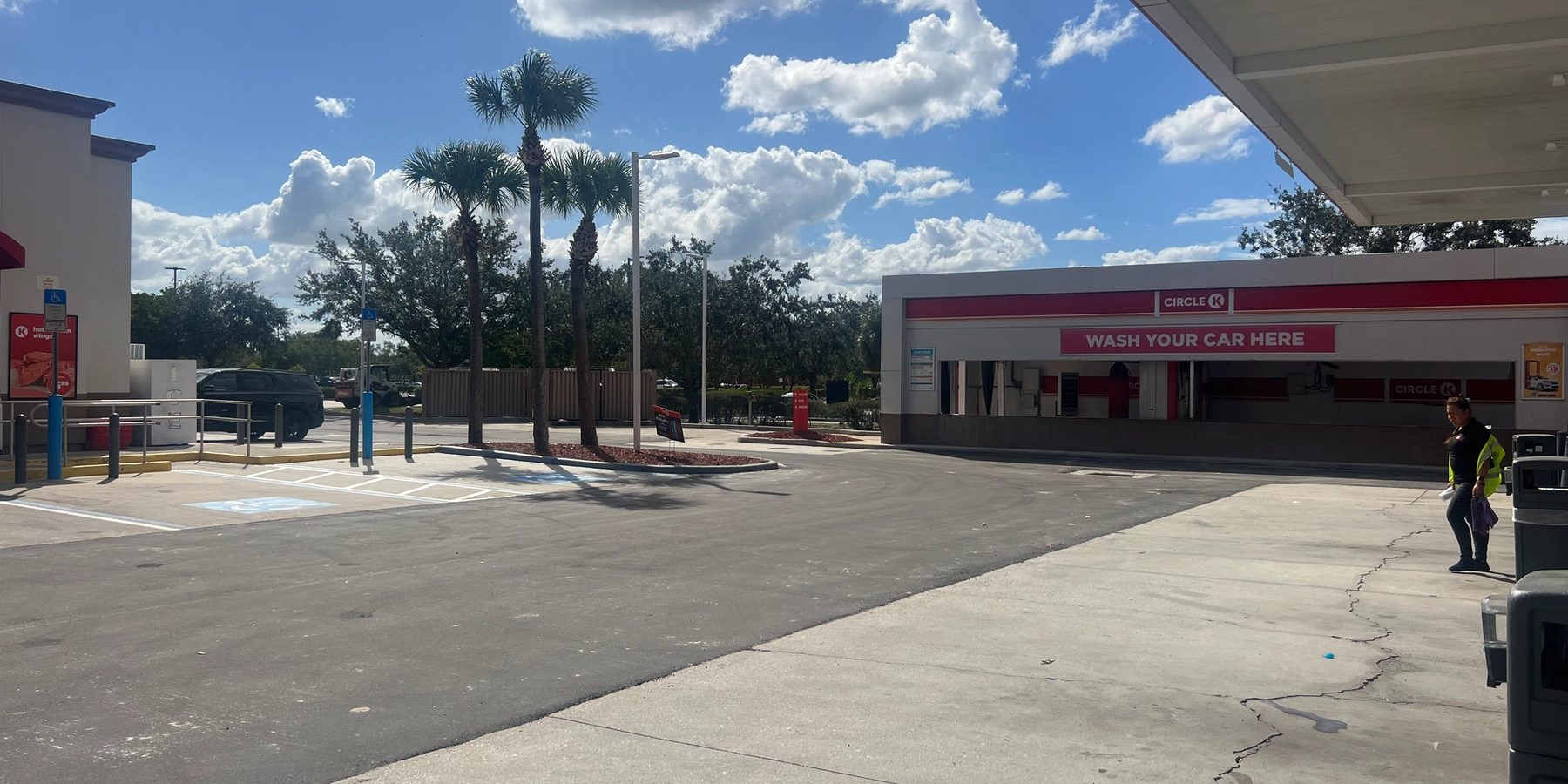 Asphalt pavement work beside a Circle K store and car wash