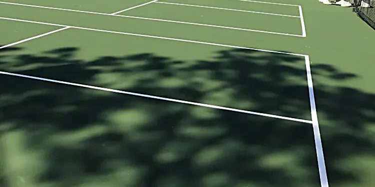 Resurfaced tennis courts with fresh white game lines