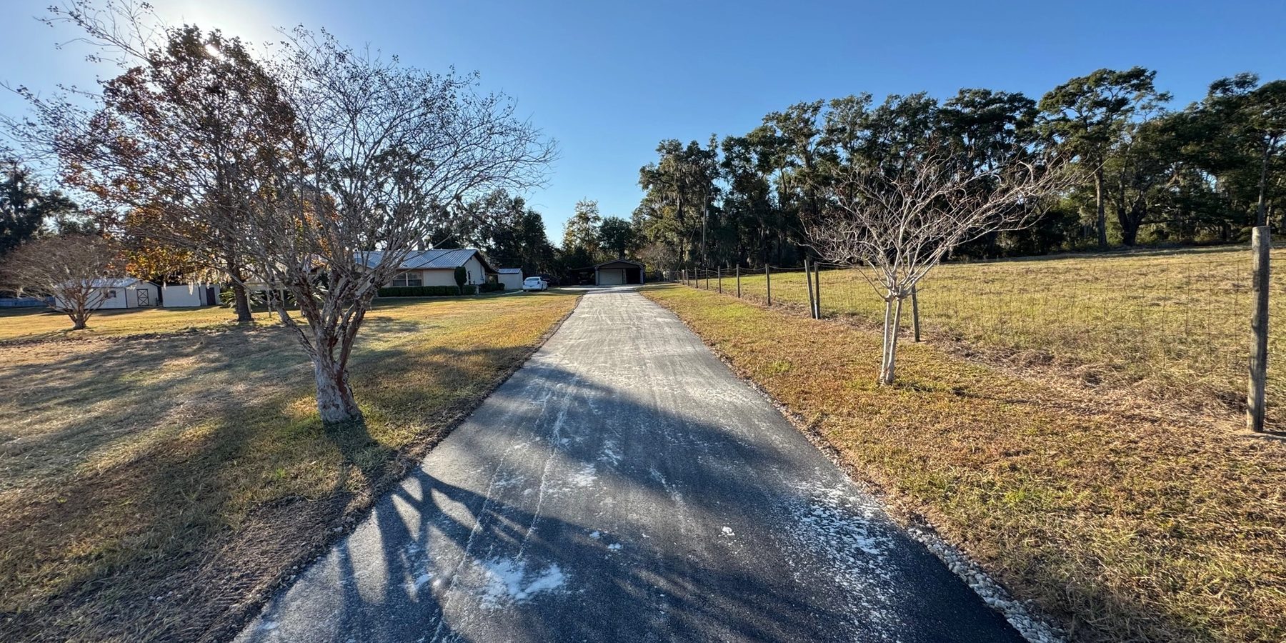 Finished residential asphalt driveway and walkway