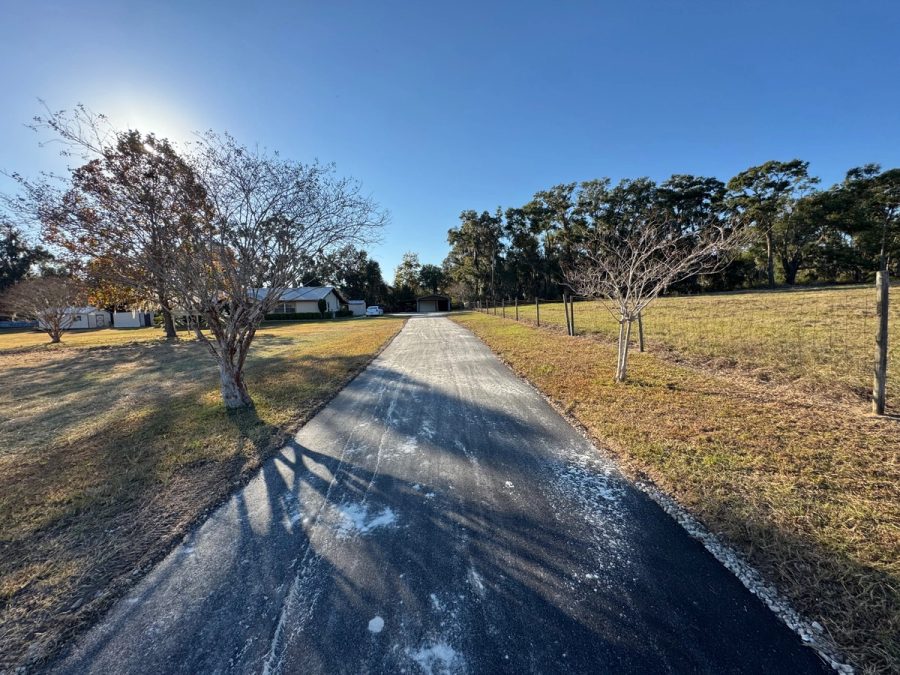 Finished residential asphalt driveway and walkway