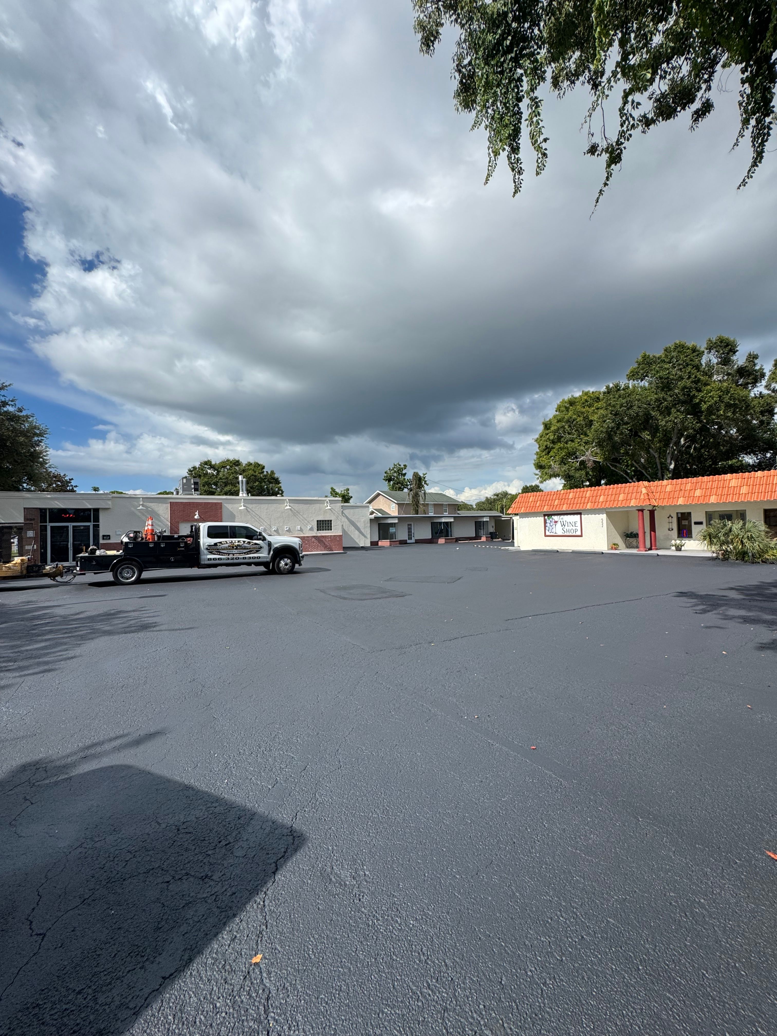Wide view of a resurfaced and striped commercial parking lot