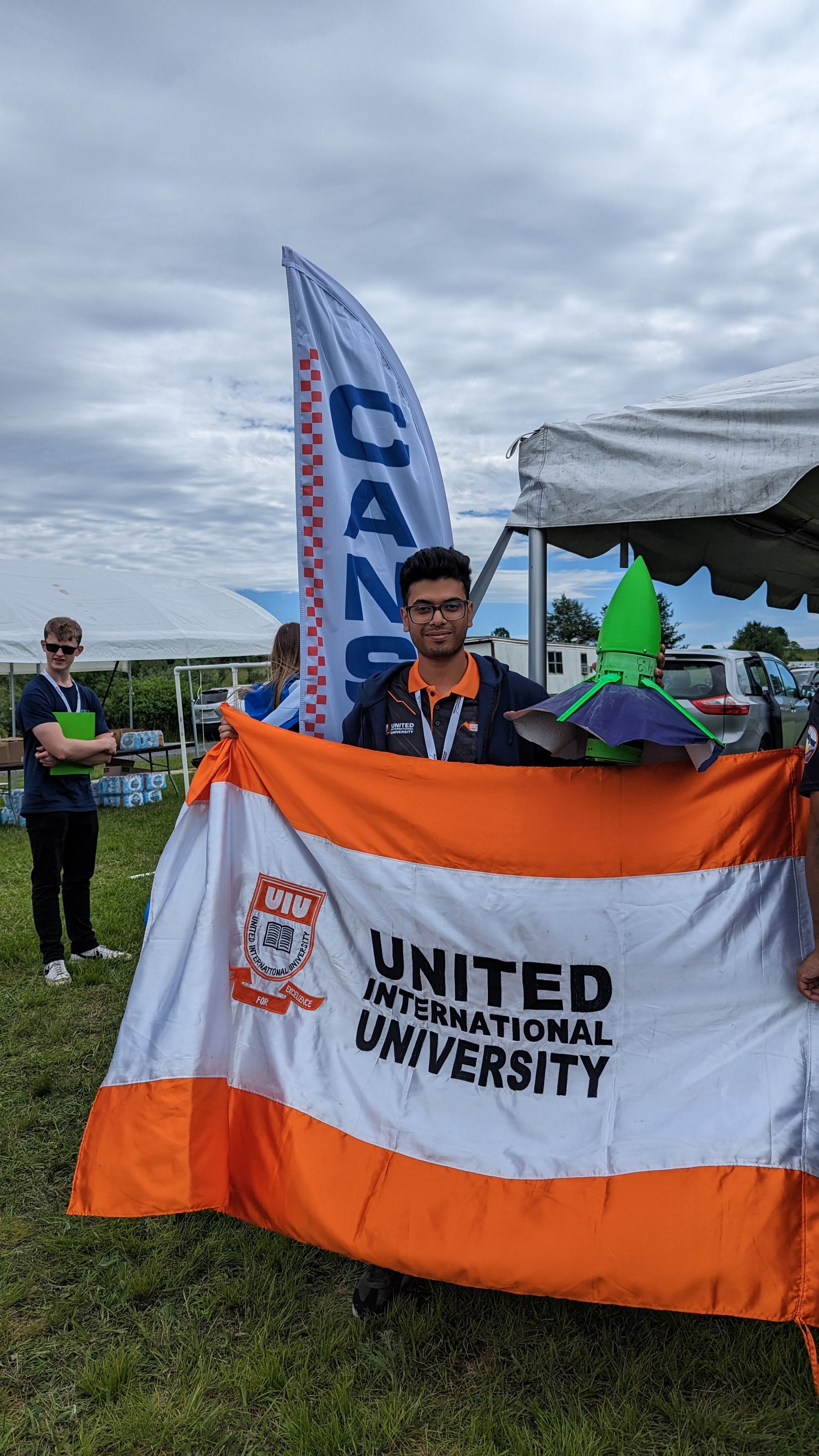 Al Reasat Rafio holding UIU Flag in Cansat 2024 competition