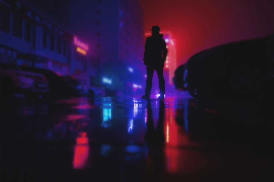 Out of focus image of an unknown neon sign in a dark setting.