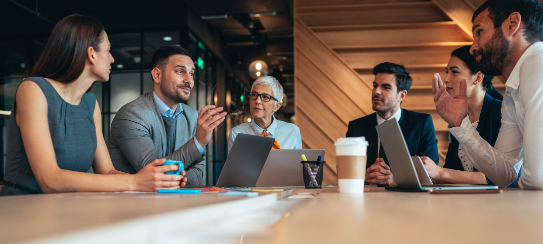 A leadership team in a focused workplace discussion