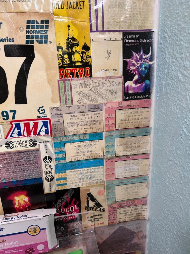 Bathroom wall of ticket stubs, detail shot.