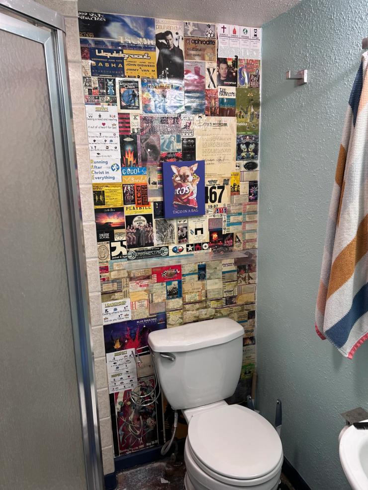 Ticket stubs wallpapered floor to ceiling in the bathroom.