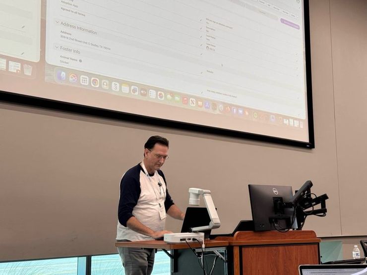 John presenting the live Salesforce system — adoption records, foster info, all of it