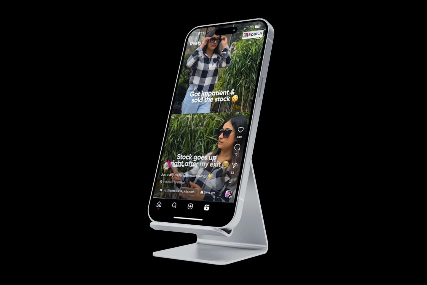 A phone on a stand playing a 5paisa community reel