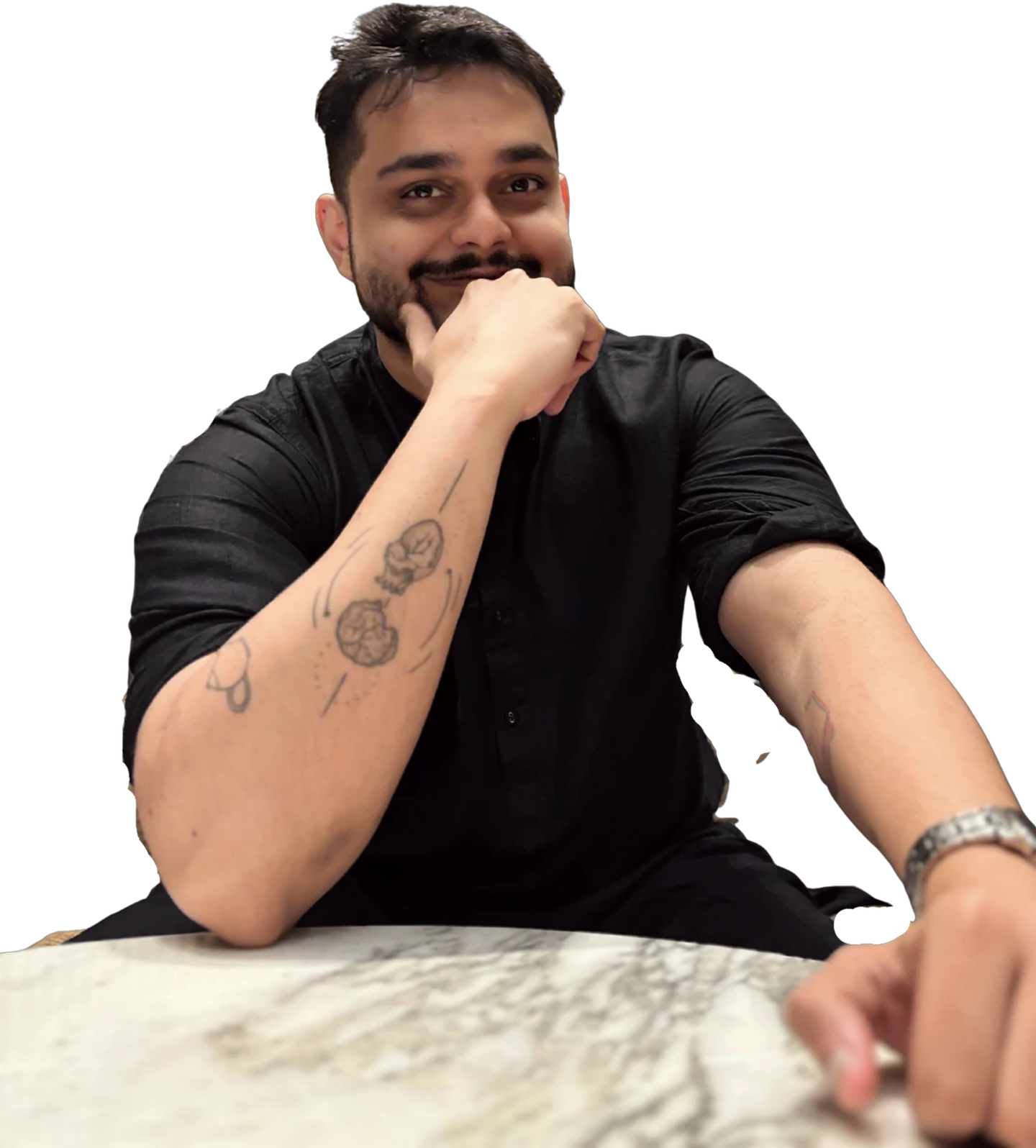 Kaustav Chowdhury, chin on his fist, smiling