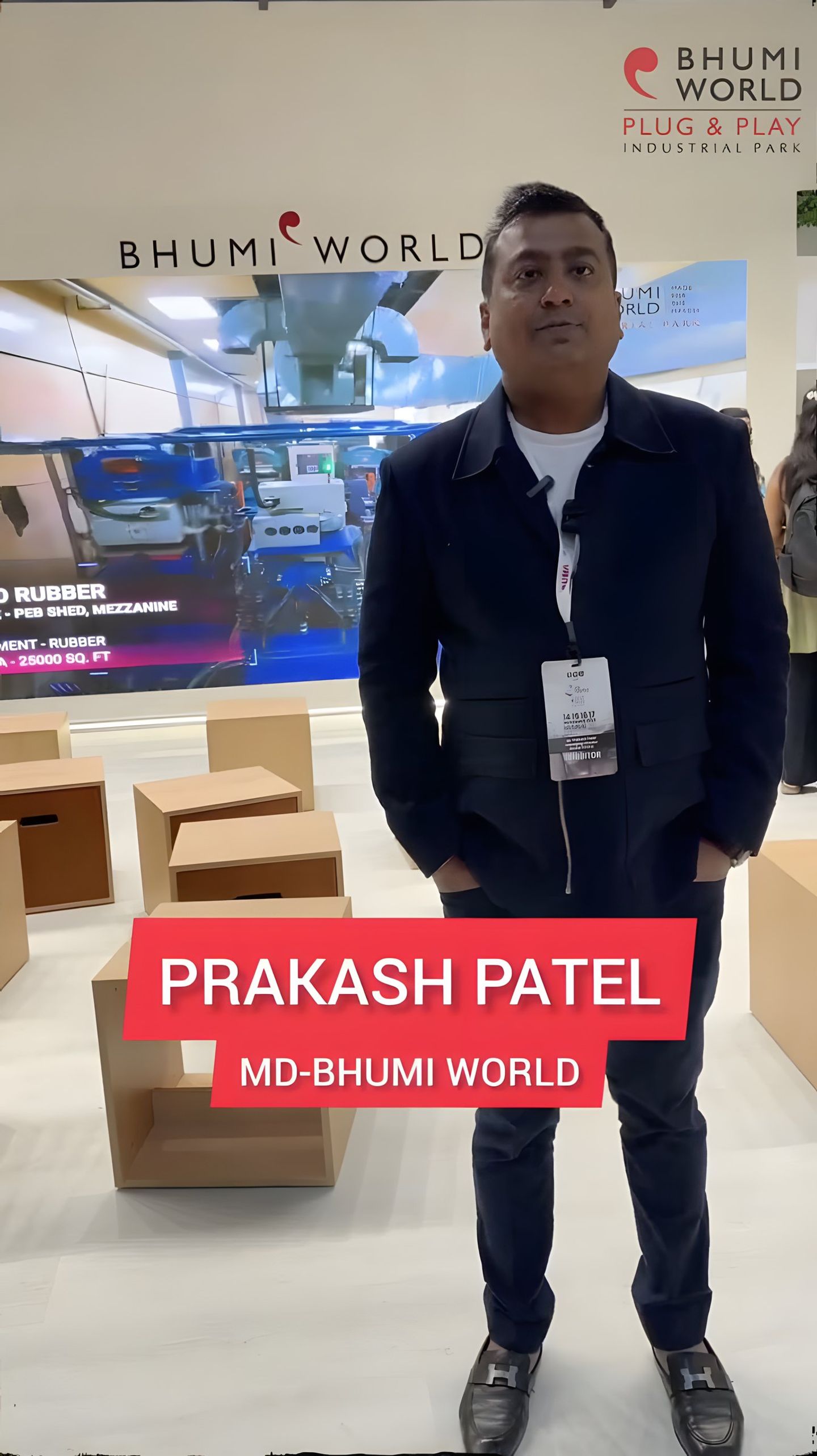 Prakash Patel, MD, Bhumi World, standing at the booth