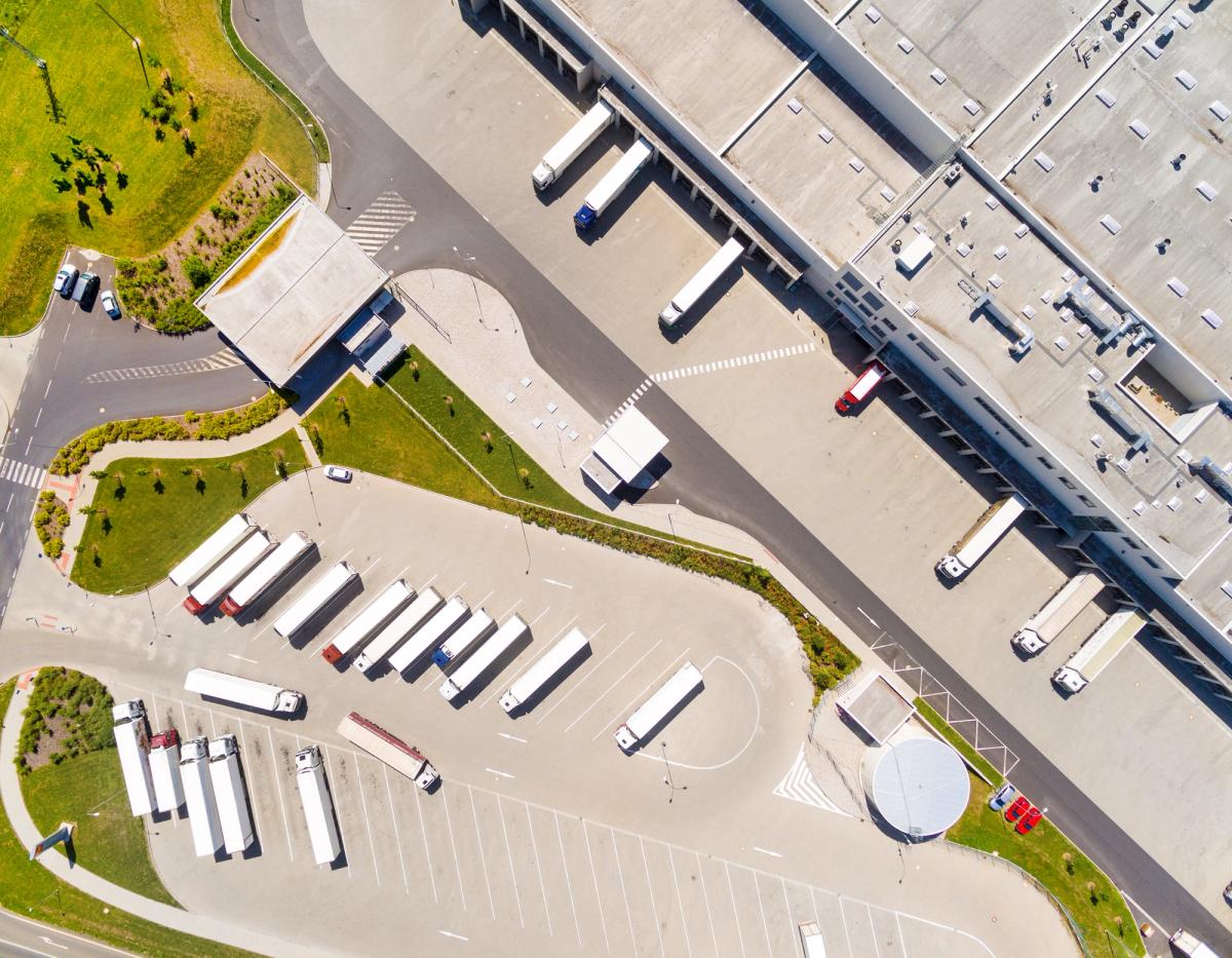 Aerial view of warehouse with trucks