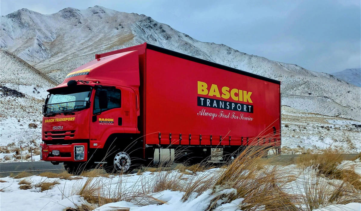 Bascik Transport truck driving through Lindis Pass Bascik Transport truck driving through Lindis Pass