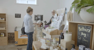 Woman buying product at Ecostore shop Woman buying product at Ecostore shop