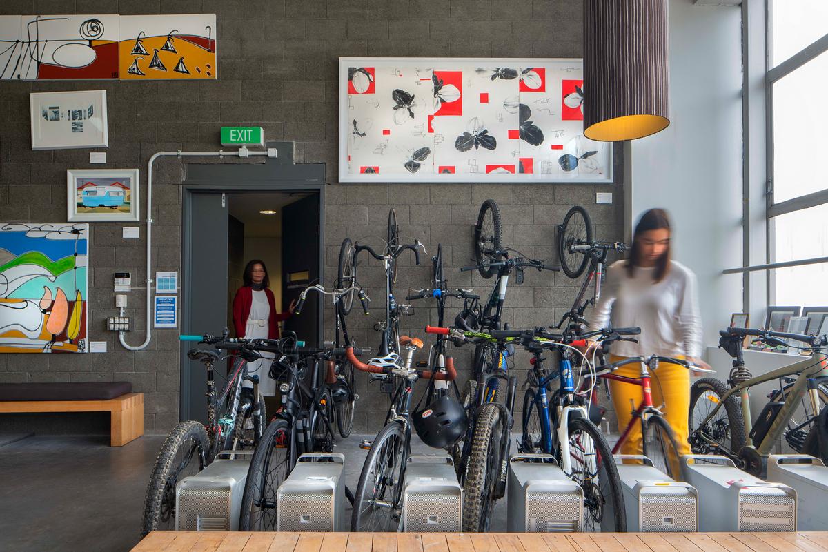 Lady putting her bike away in the Studio Pacific Architecture Wellington Office
