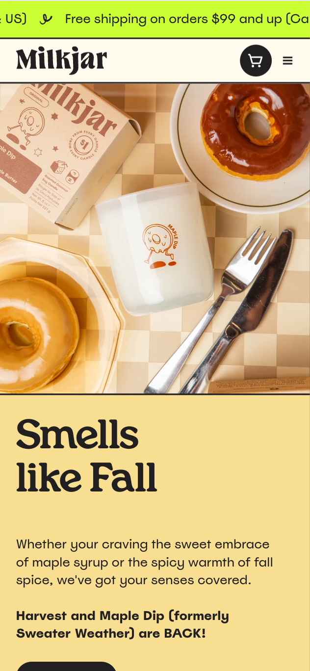 Milkjar mobile site with a flat-lay photo of a candle, kraft box, donuts, and cutlery, headlined 'Smells like Fall' over a mustard-yellow section.