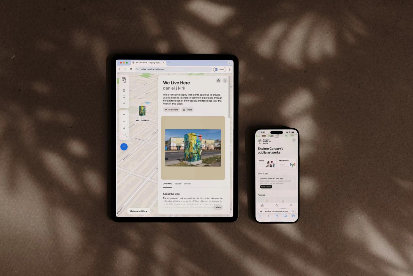 The Calgary Public Art Guide open on a tablet and a phone, showing an artwork's location on the map beside its detail card.
