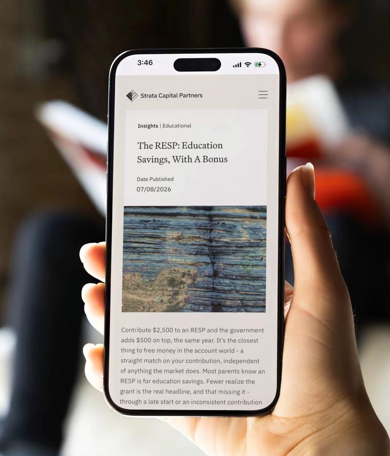 A hand holding a phone that shows a Strata Capital Partners insights article about RESP education savings.
