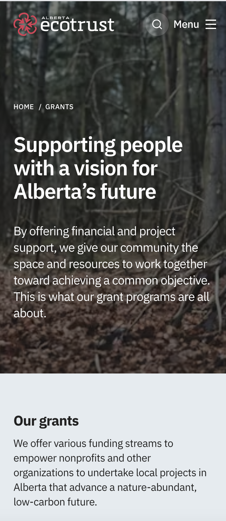 Alberta Ecotrust mobile grants page over a forest photo, headlined 'Supporting people with a vision for Alberta's future,' with an 'Our grants' section below.