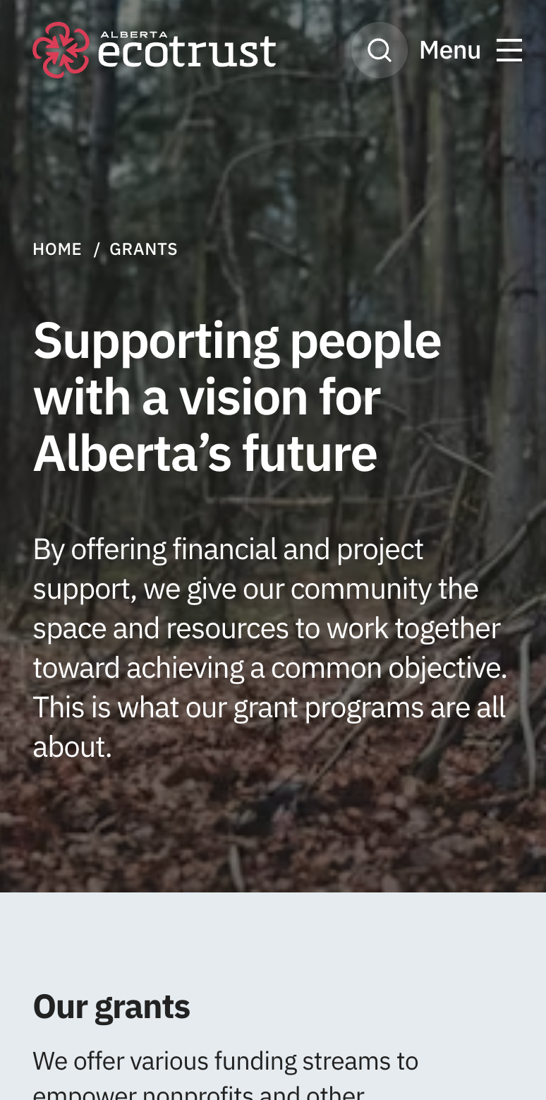 Alberta Ecotrust mobile grants page over a forest photo, headlined 'Supporting people with a vision for Alberta's future,' with an 'Our grants' section below.