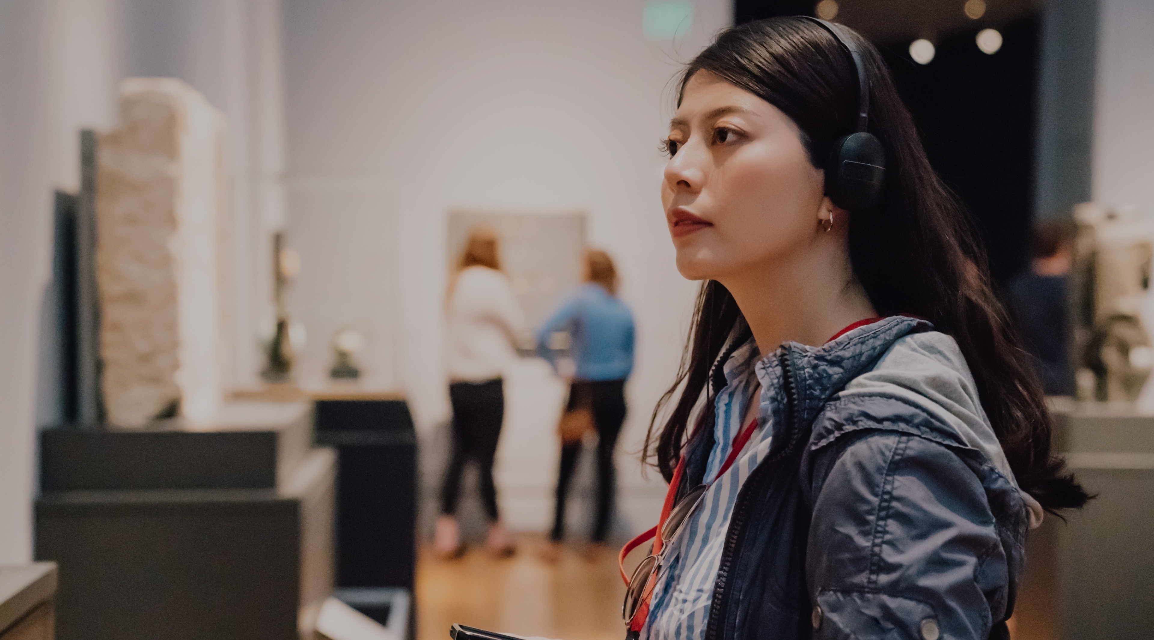 A woman standing in an art gallery