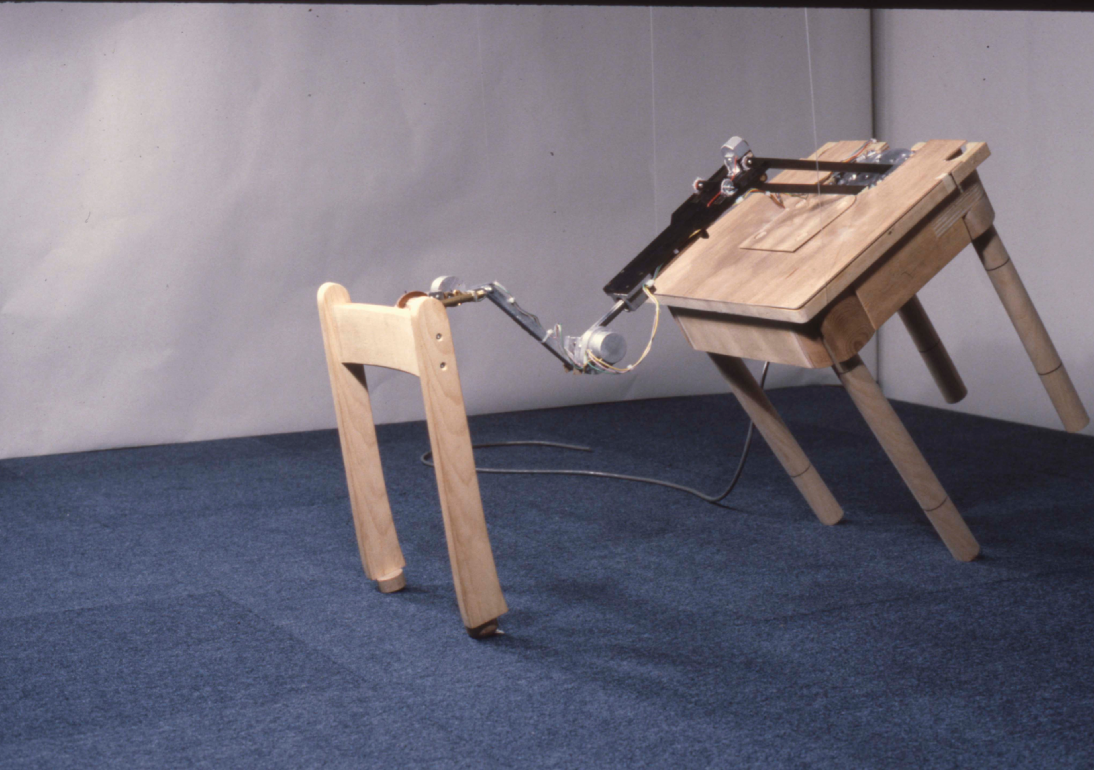 Parts of a wooden chair connected by mechanical arm