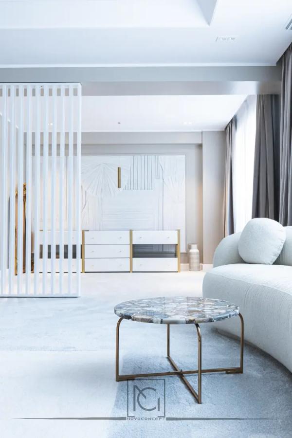 Colț de dormitor cu paravan alb din lamele, măsuță cu marmură și canapea curbată – Penthouse B. V., București