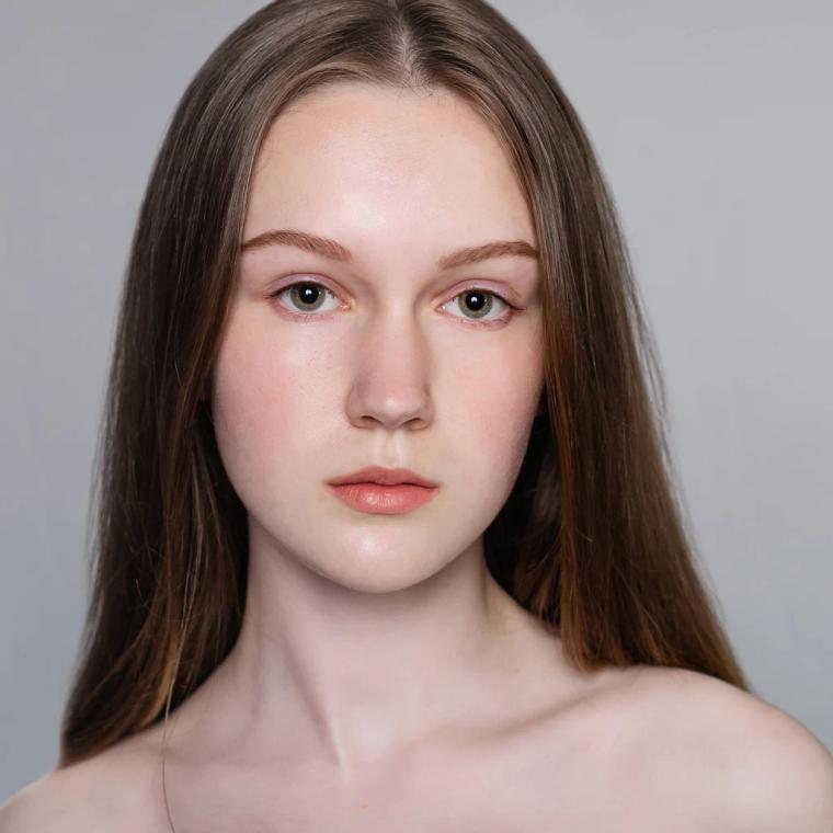 Retouched studio portrait of the same young woman