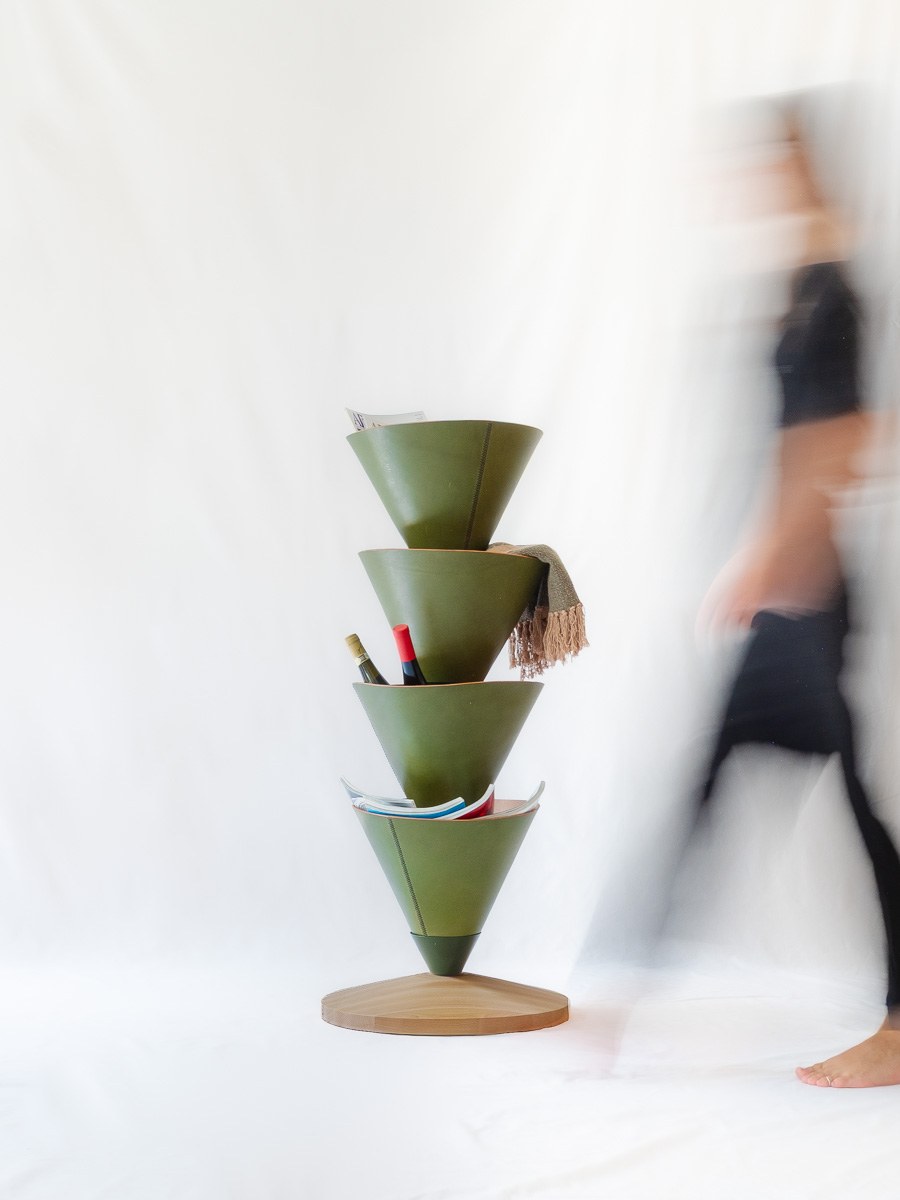 House Palm by NOEMAR — stylised palm-tree shelf of stacked leather cones on a central mast. Wiener Norm collection, 2026 (view 2 of 8).