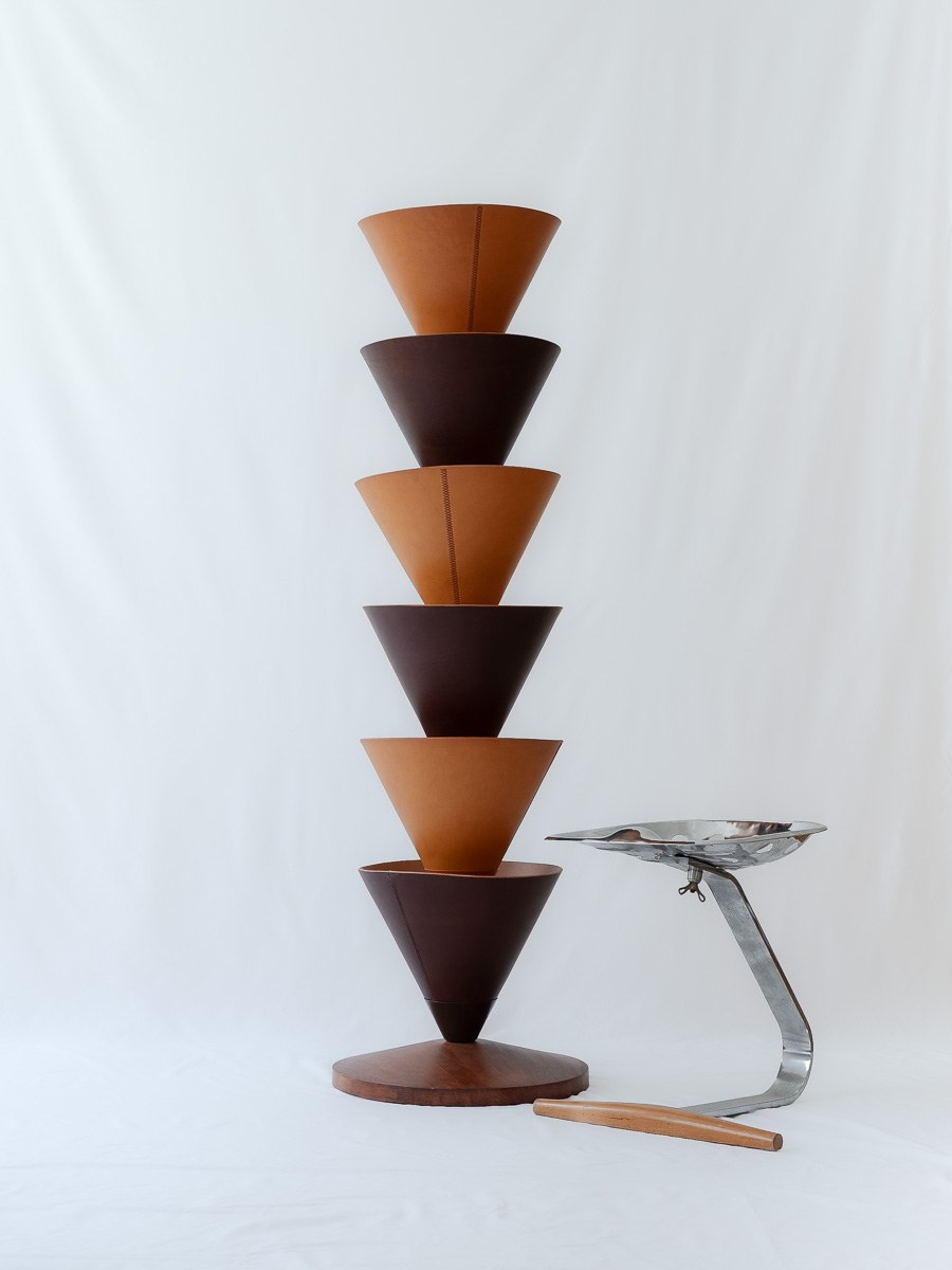 House Palm by NOEMAR — stylised palm-tree shelf of stacked leather cones on a central mast. Wiener Norm collection, 2026 (view 5 of 8).