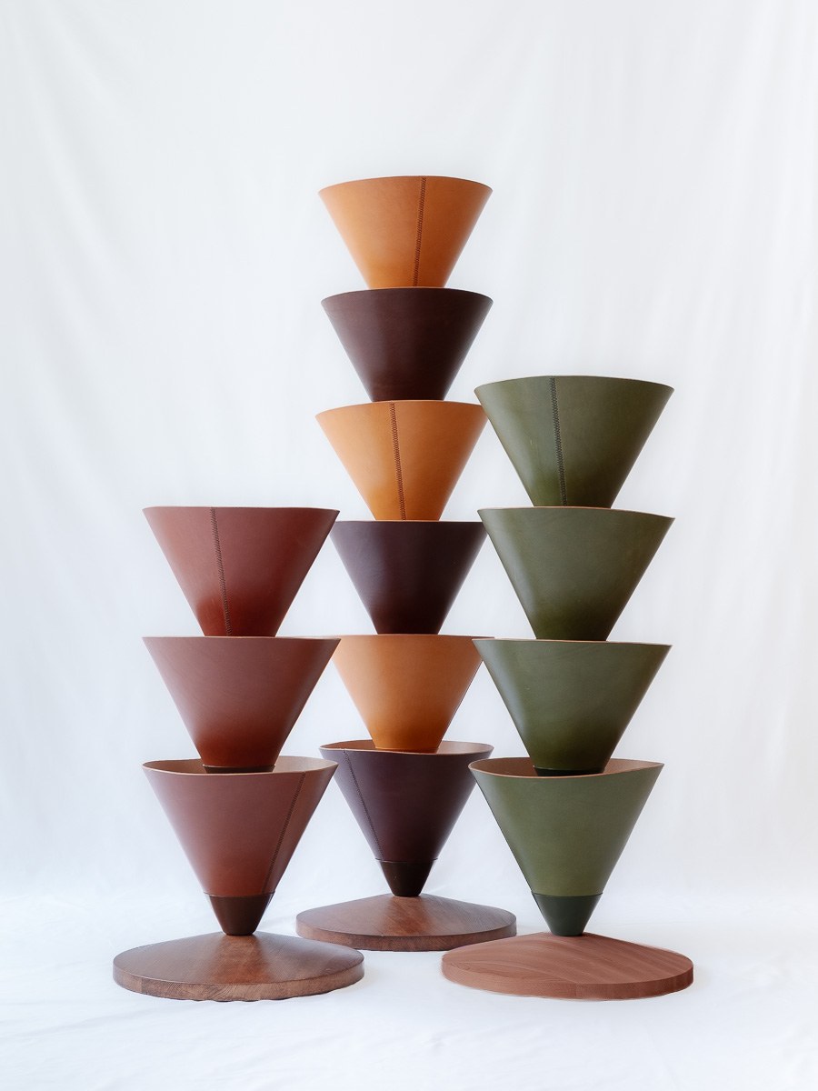 House Palm by NOEMAR — stylised palm-tree shelf of stacked leather cones on a central mast. Wiener Norm collection, 2026 (view 4 of 8).