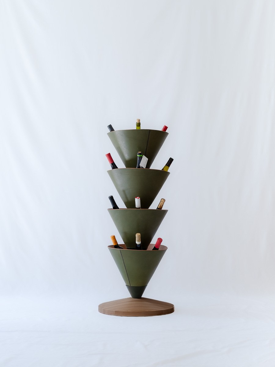 House Palm by NOEMAR — stylised palm-tree shelf of stacked leather cones on a central mast. Wiener Norm collection, 2026 (view 8 of 8).