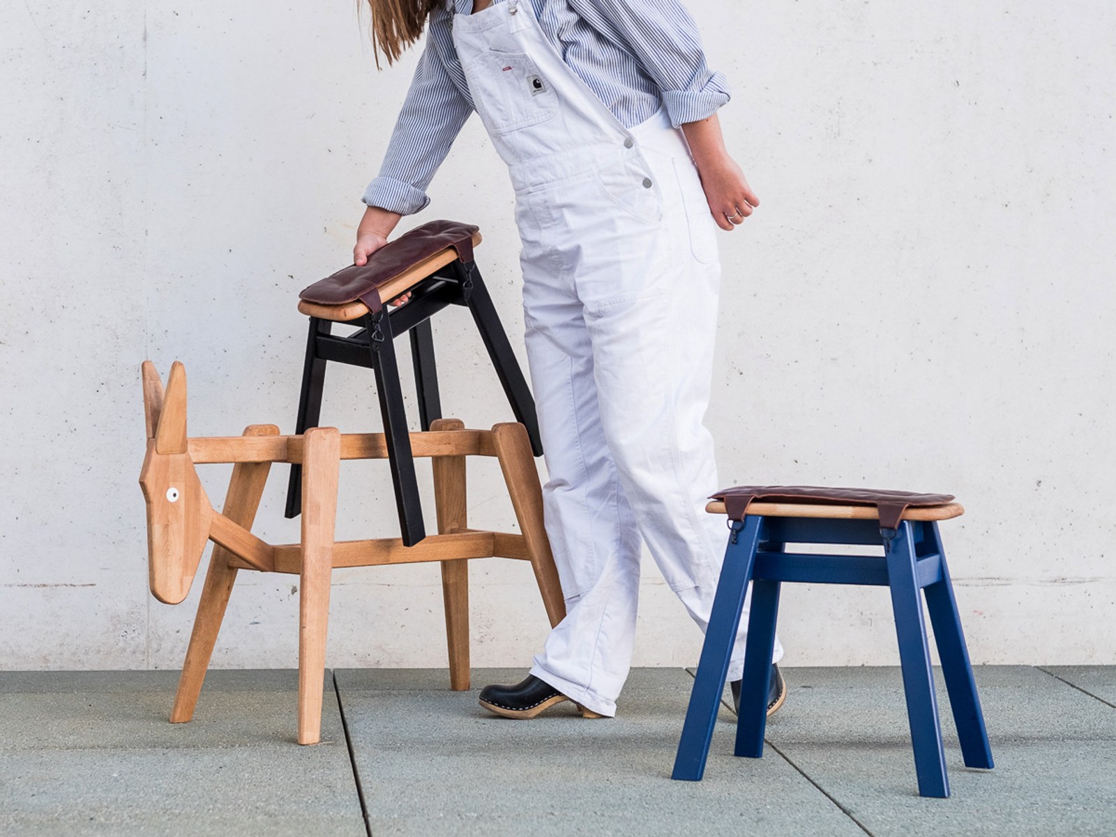 Donkey by NOEMAR — a donkey-shaped wooden stool and cart system on castors, carrying a drinks module on its back.