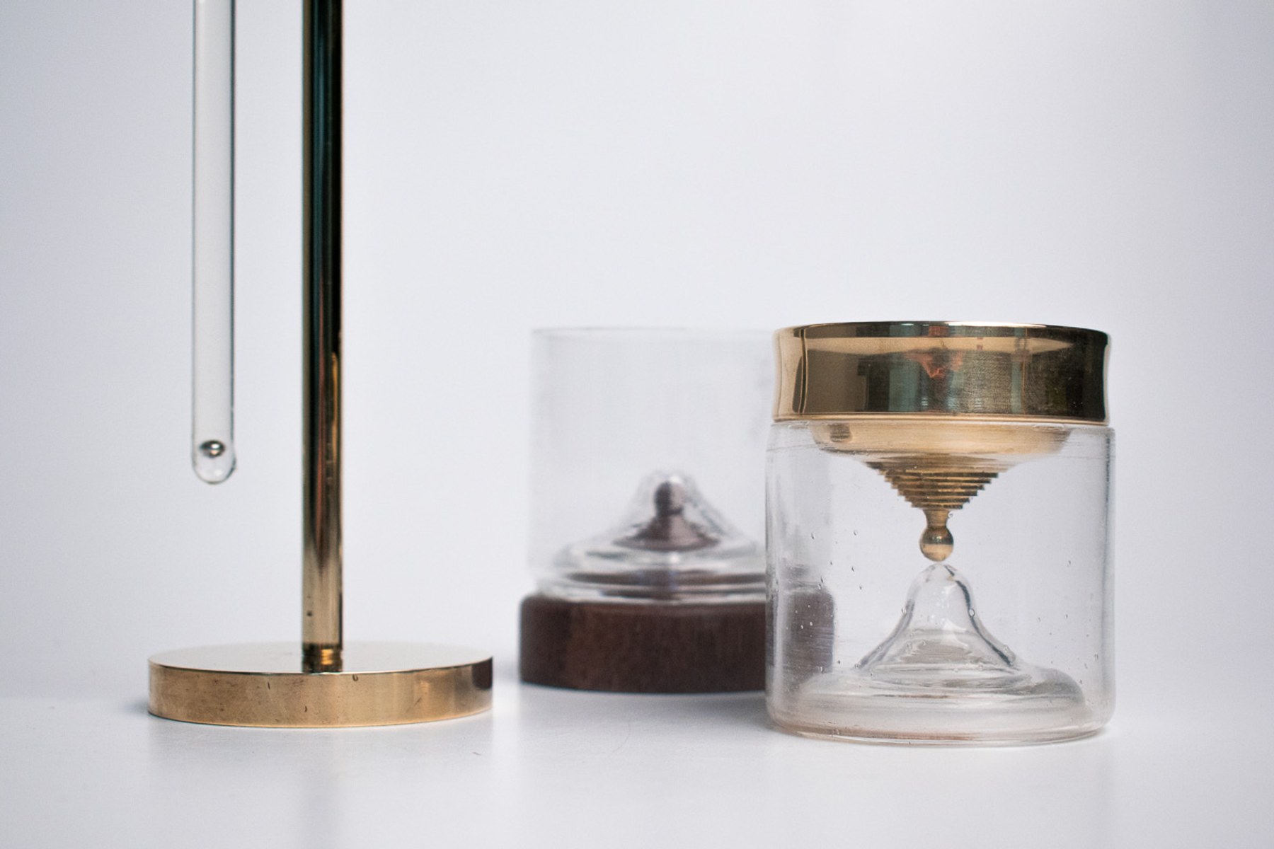 In Limbo — the timer stand, the chalice, and a plain wooden-lidded glass together.