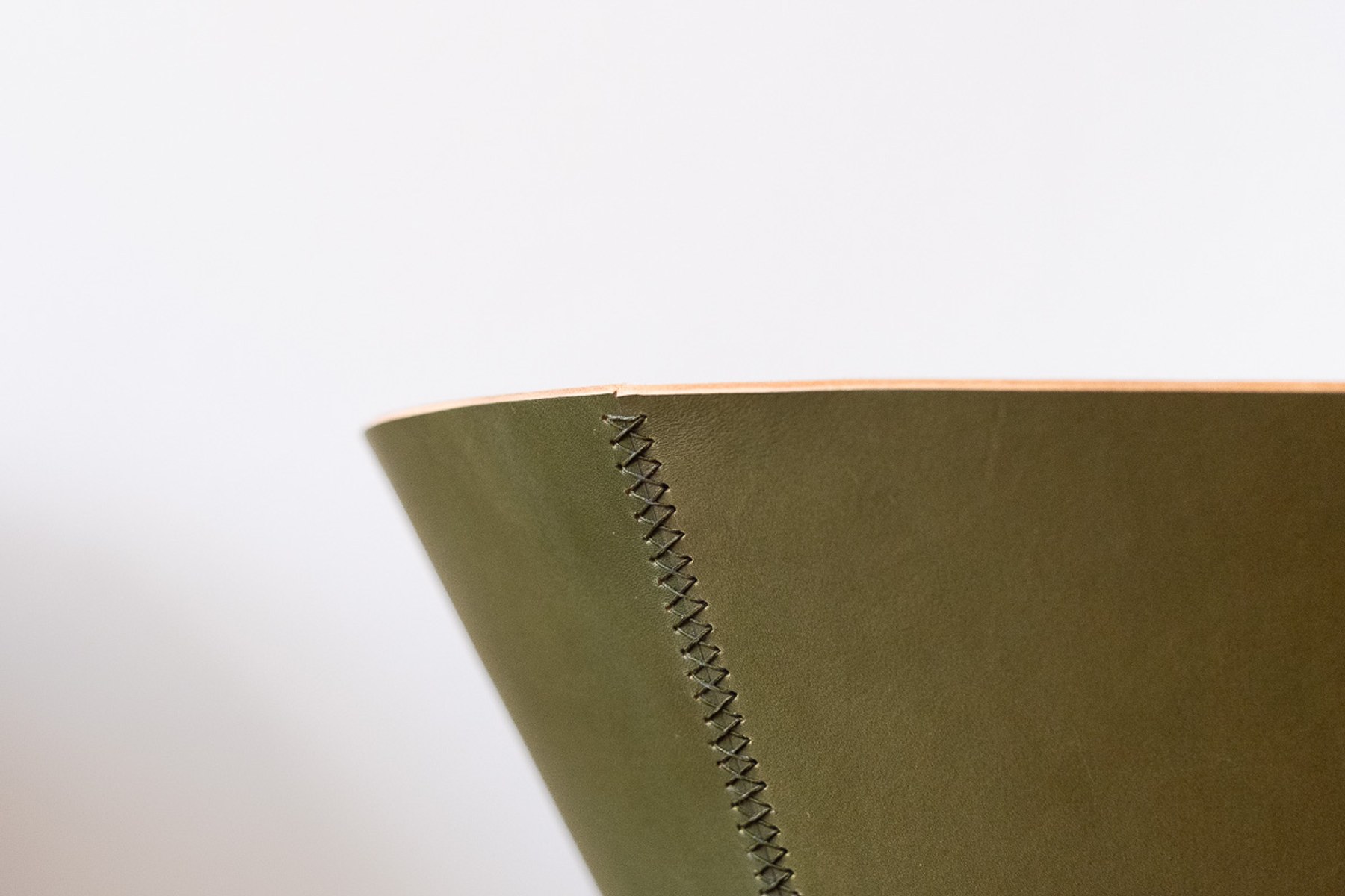 House Palm by NOEMAR — stylised palm-tree shelf of stacked leather cones on a central mast. Wiener Norm collection, 2026 (view 7 of 8).