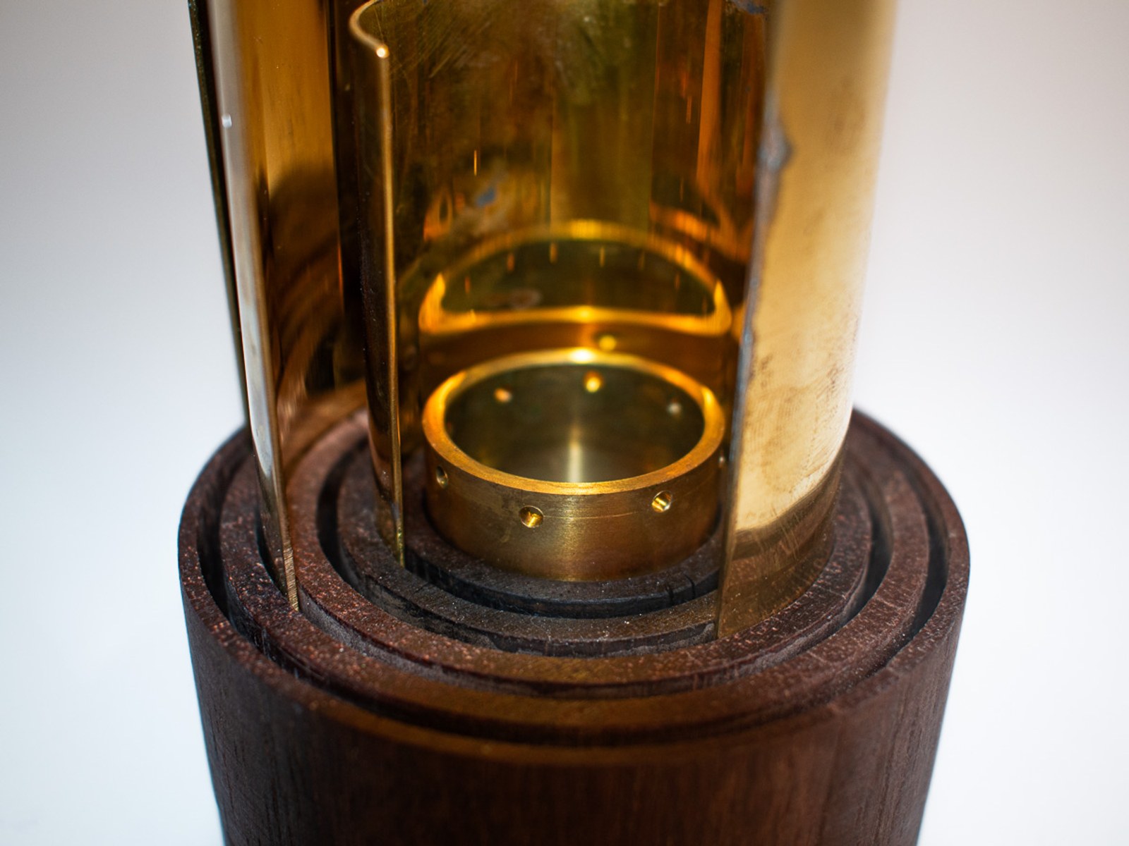 In Limbo — detail looking down into the brass and oak lamp housing.