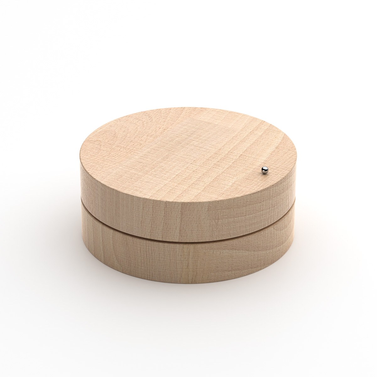 Toki by NOEMAR — studio view of the wooden disc from a slightly different angle, steel ball at the rim.