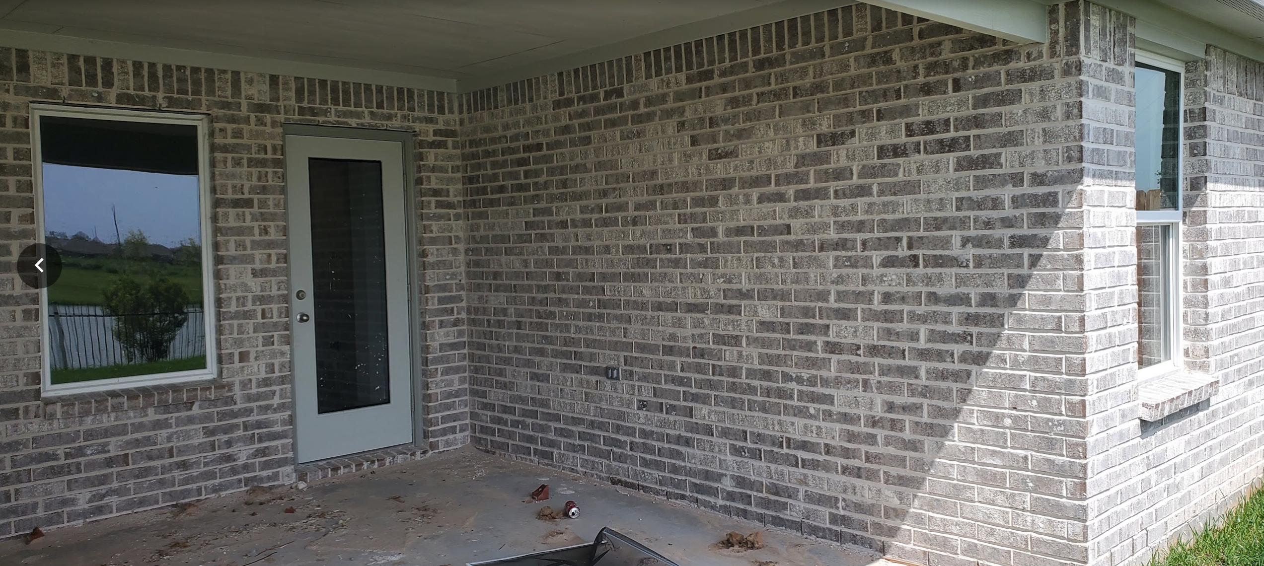 Existing covered concrete patio before outdoor patio renovation