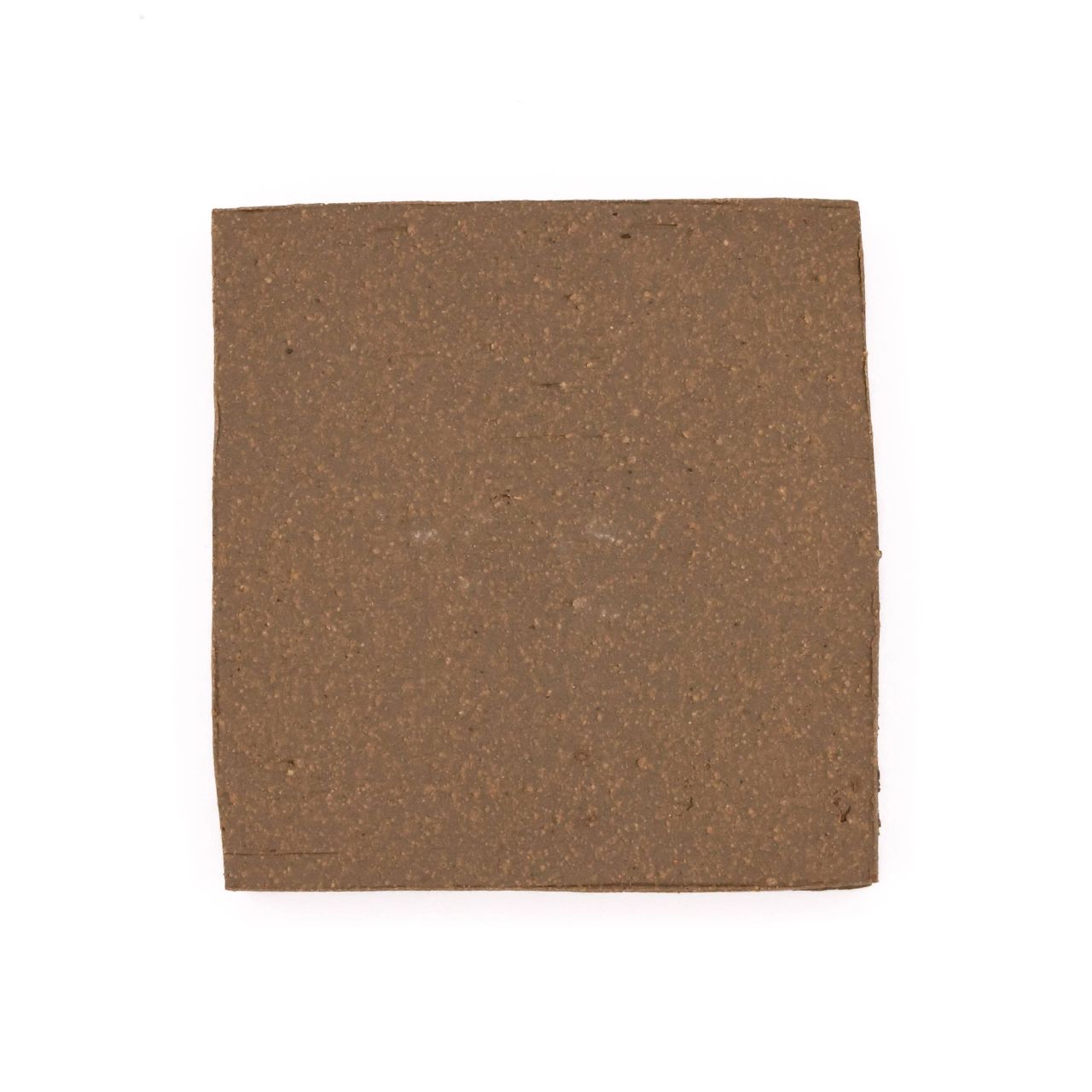 A square fired slab in warm mid-brown, its surface finely grainy and flecked with darker specks.