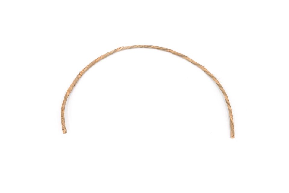 A single length of the cord bent into a wide arch, holding its curve and showing the tight spiral of the twist.