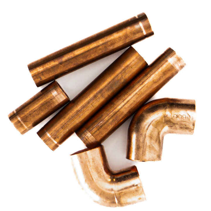The pipe lengths and elbow fittings seen closer and from above, their polished surfaces and cut ends clearly separated.