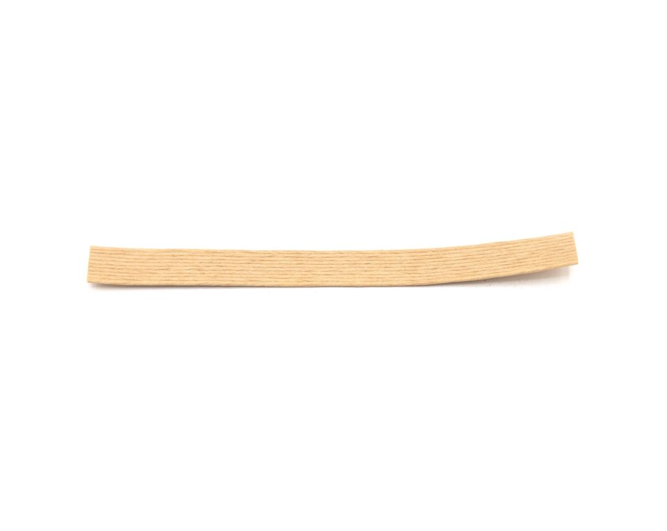 A single flat splint of hickory bark in pale straw, long and slightly bowed with fine grain running its length.