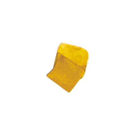 A small irregular sheet of brass in bright yellow-gold, its surface faintly mottled where the light catches, one edge curling upward.