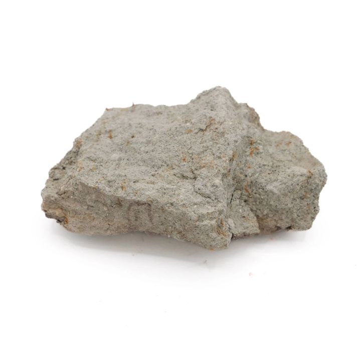 Another chunk seen from a lower angle, its layered crumbling profile and coarse grit standing out against the flatter view.