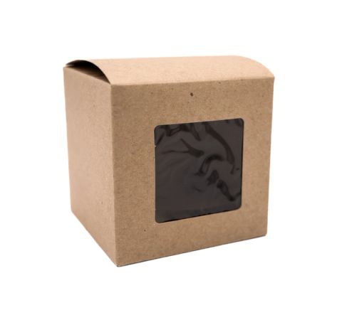 A small kraft-brown box with a folded lid and a square window cut into the front, a dark marbled surface visible inside.