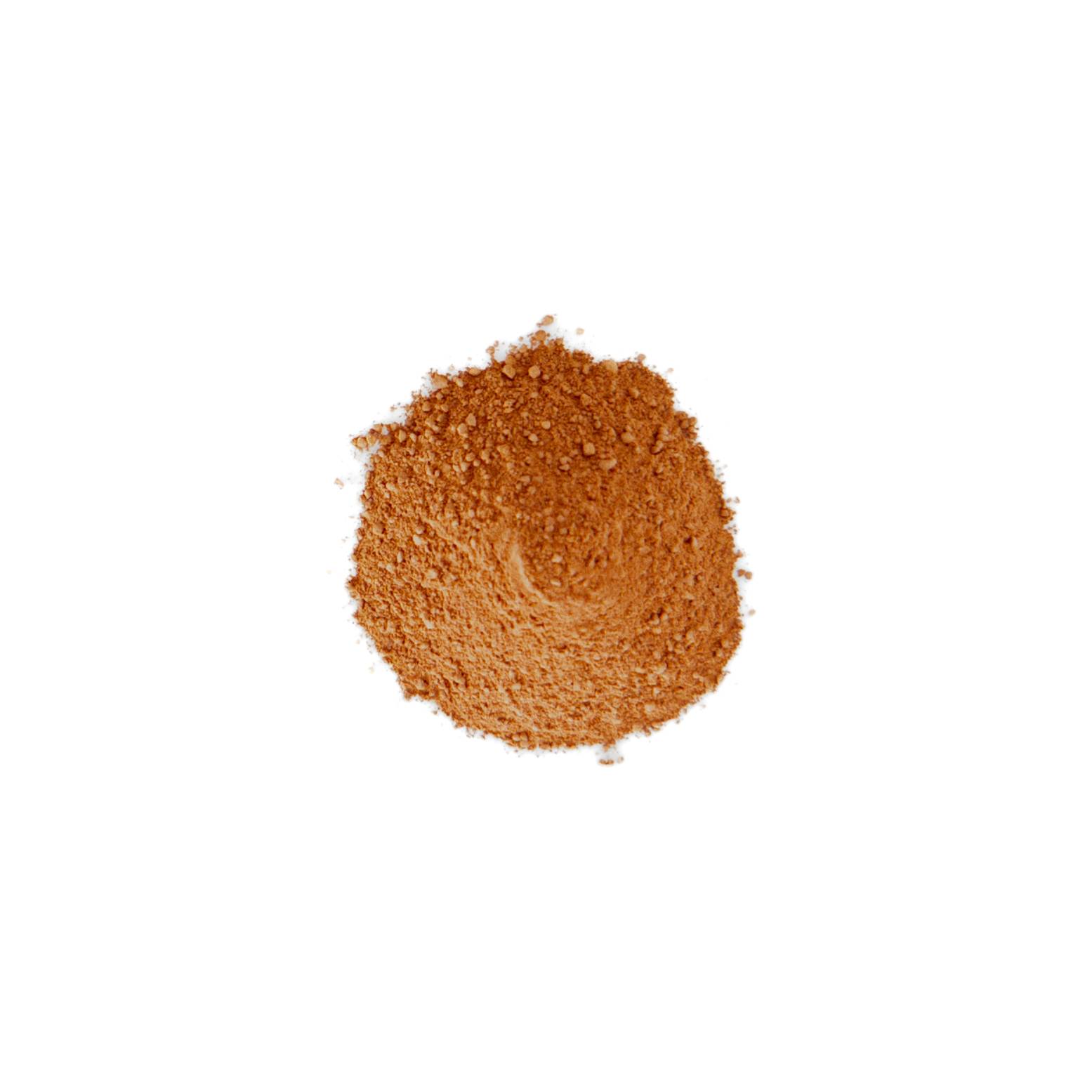 A small heap of dry clay powder in warm rust orange, coarsely granular with a faint swirl where it was poured.