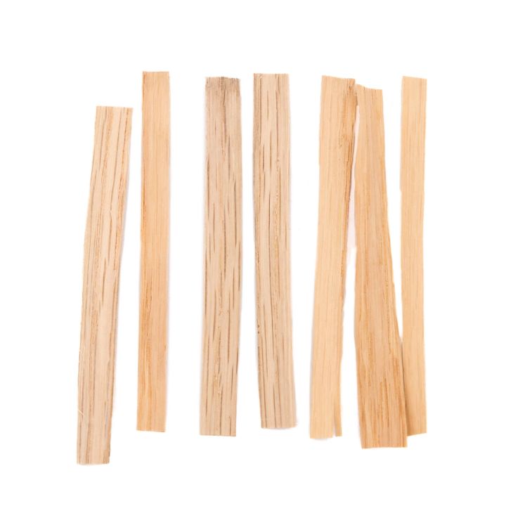 Seven flat splints laid upright in a row, pale and even, their surfaces showing fine lengthwise fibres.