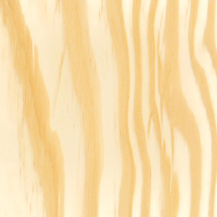 A close view of the grain, broad wavy bands of cream and warm tan running vertically across the whole frame.