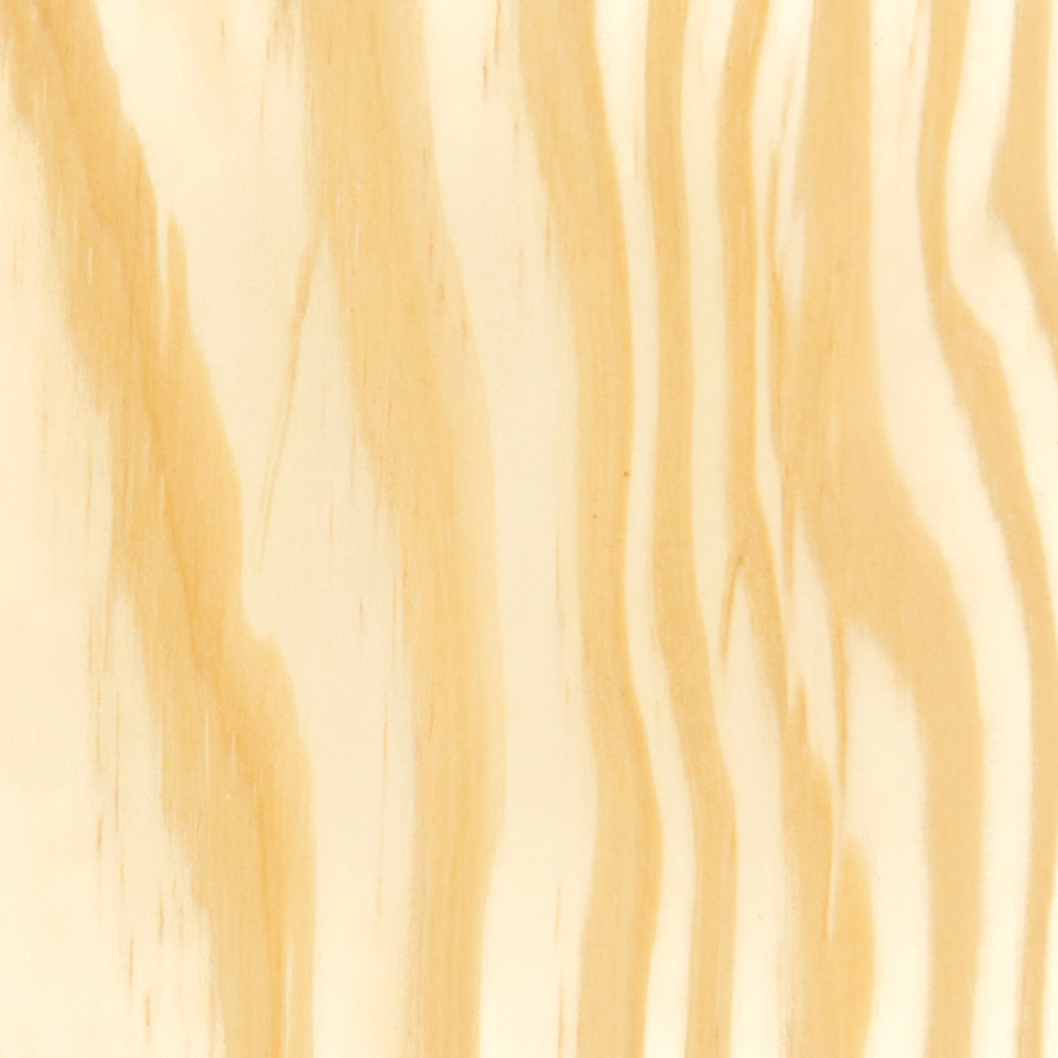 A close view of the grain, broad wavy bands of cream and warm tan running vertically across the whole frame.