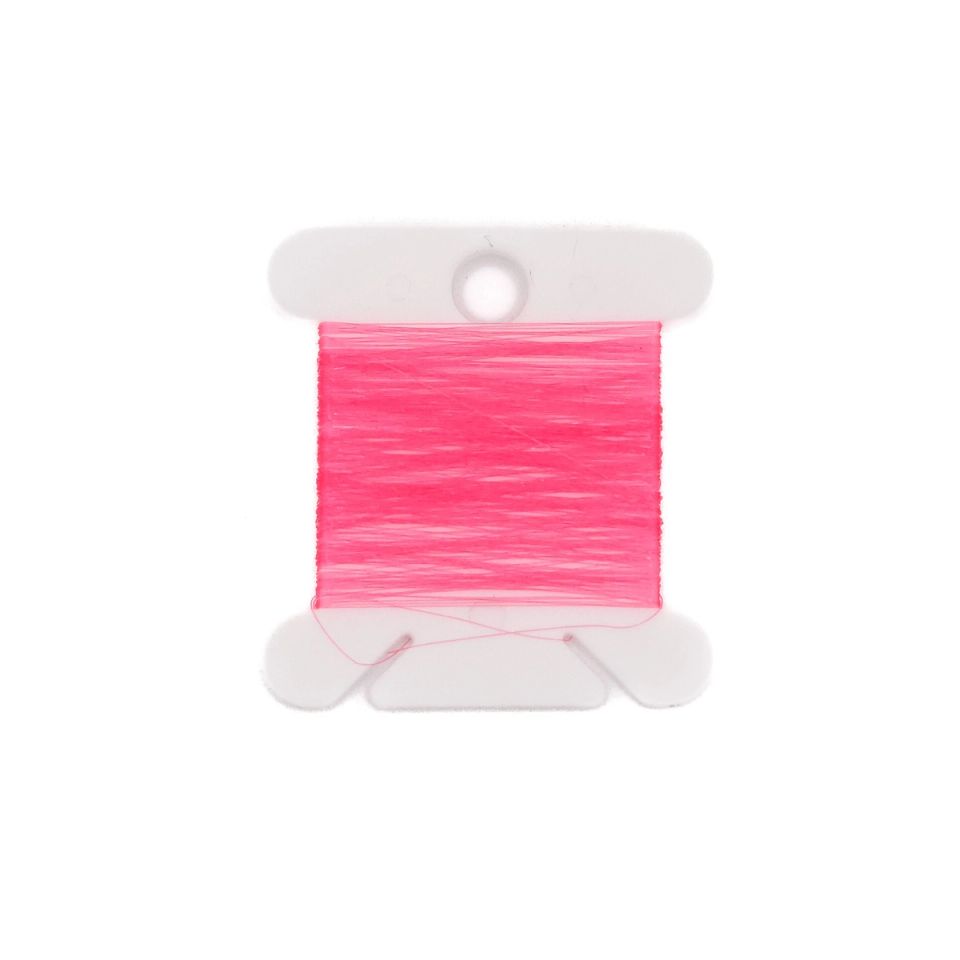 Fine hot-pink filament wound in a dense flat block on a white bobbin, a single loose strand looping beneath.